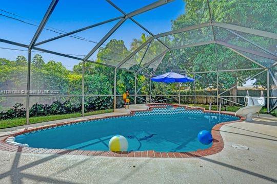 5440 Buchanan Street Hollywood, FL 33021 - Photo 16 of 34 a view of a backyard with swimming pool and furniture