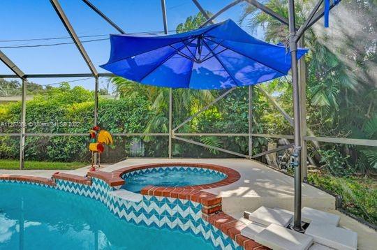 5440 Buchanan Street Hollywood, FL 33021 - Photo 20 of 34 a view of a swimming pool with a patio