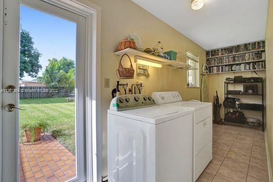 5440 Buchanan Street Hollywood, FL 33021 - Photo 32 of 34 a utility room with washer and dryer