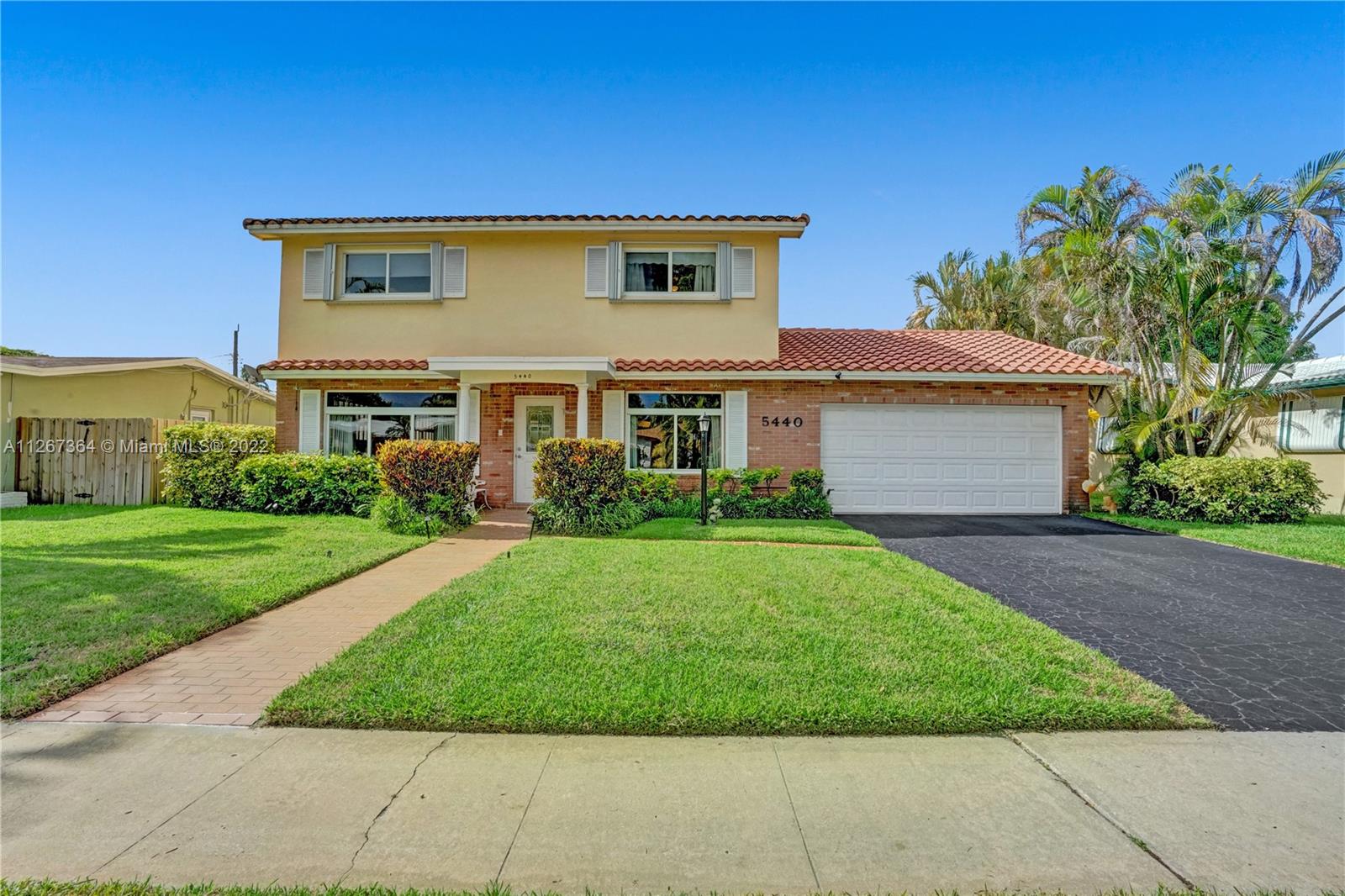 5440 Buchanan Street Hollywood, FL 33021 - Photo 34 of 34 front view of house with a yard