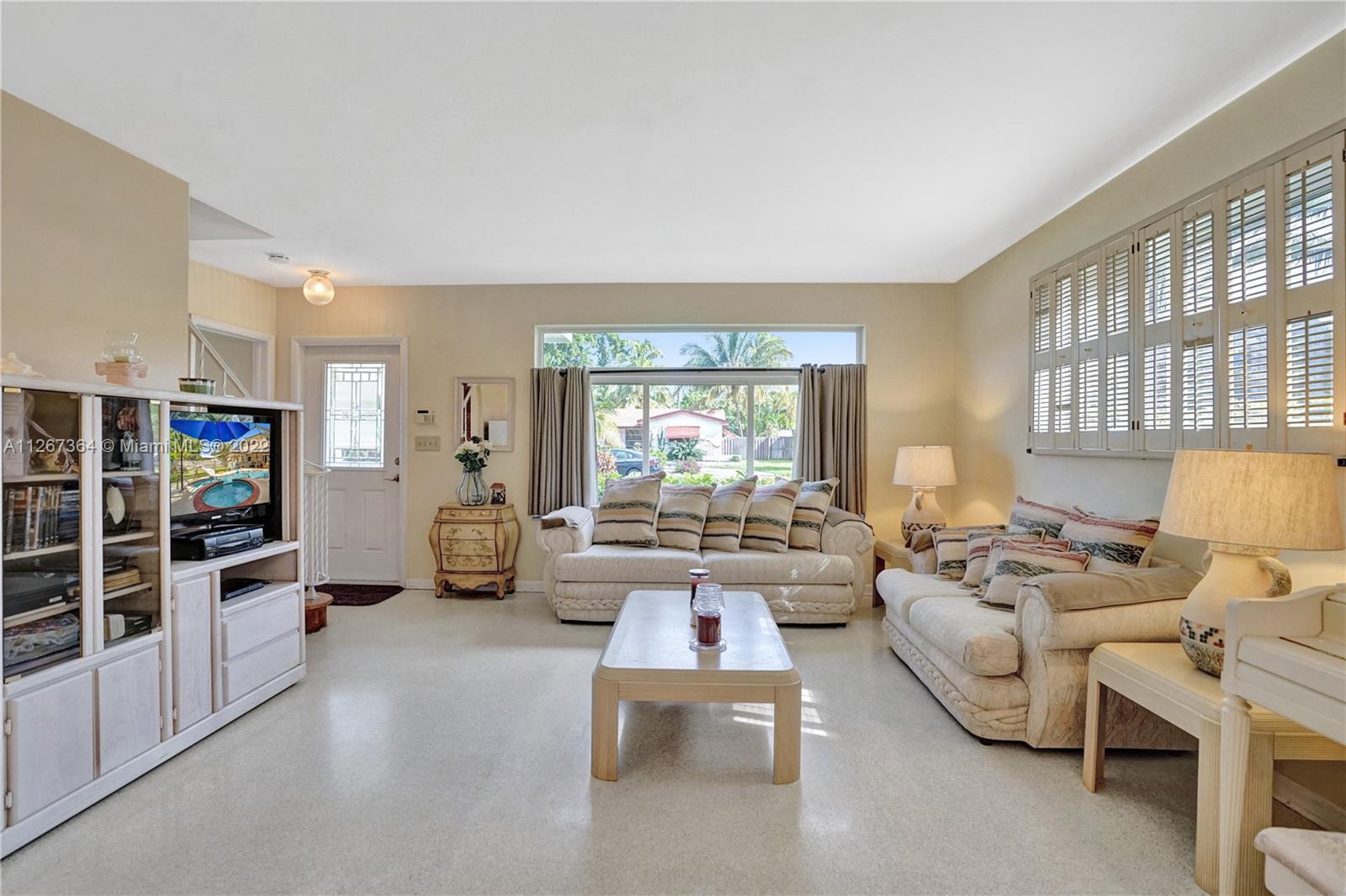 5440 Buchanan Street Hollywood, FL 33021 - Photo 5 of 34 a living room with furniture and a flat screen tv