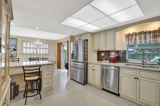 5440 Buchanan Street Hollywood, FL 33021 - Photo 10 of 34 a kitchen with refrigerator and cabinets