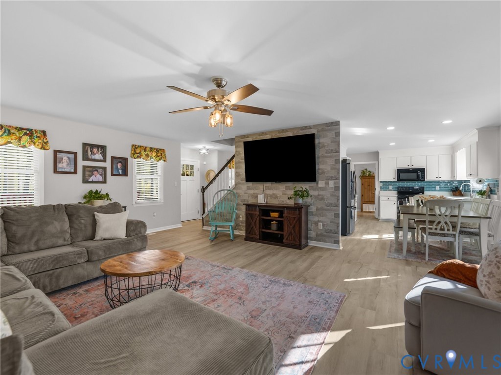 206 Rustic Drive Carson, VA 23830 - Photo 11 of 51 a living room with furniture and a flat screen tv
