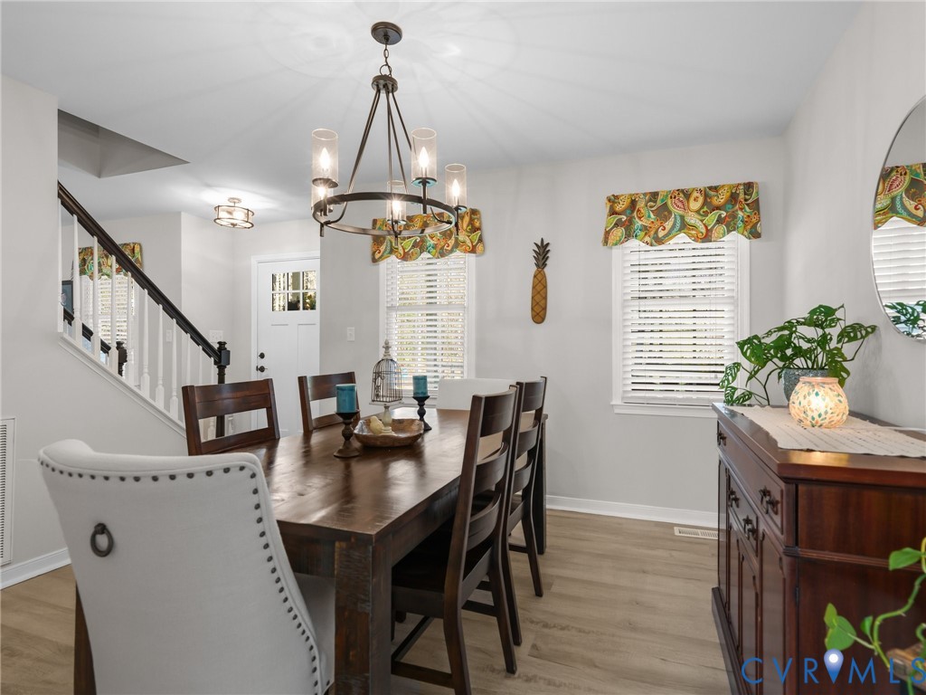 206 Rustic Drive Carson, VA 23830 - Photo 14 of 51 a view of a dining room with furniture window and wooden floor