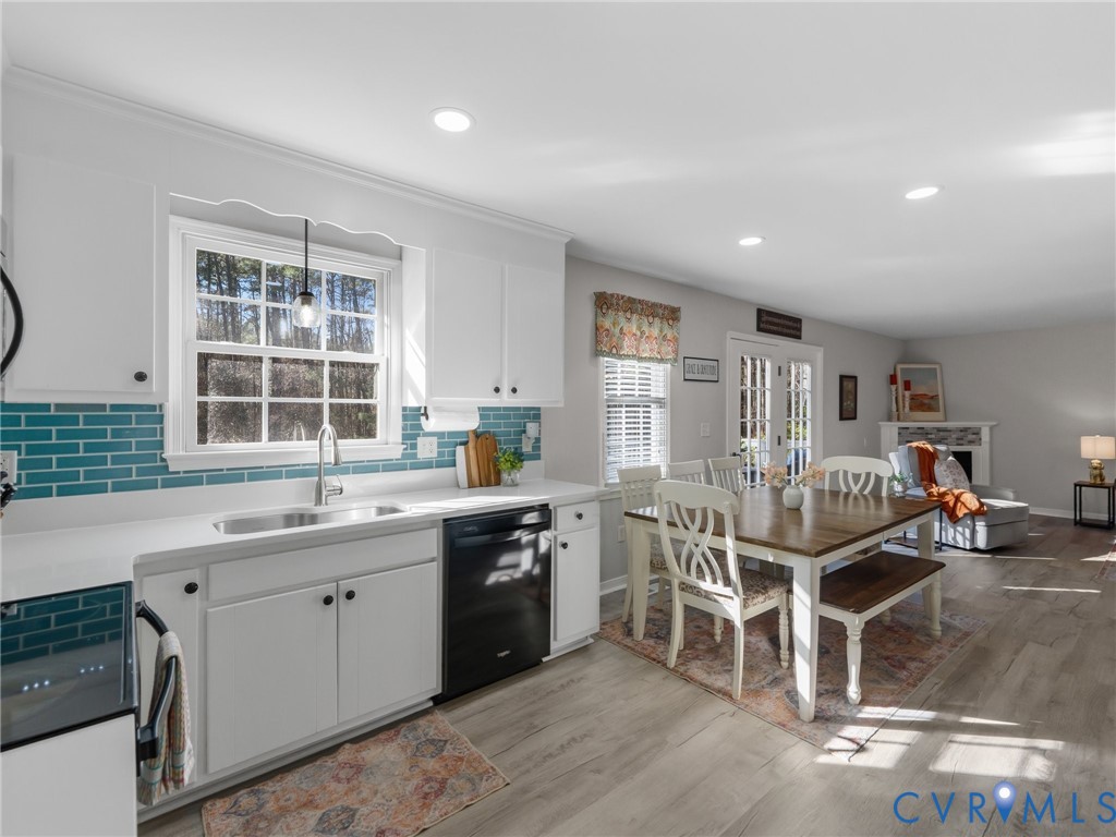 206 Rustic Drive Carson, VA 23830 - Photo 17 of 51 a dining room with a wooden table and chairs