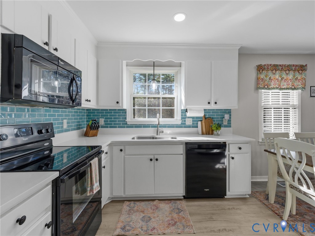 206 Rustic Drive Carson, VA 23830 - Photo 18 of 51 a kitchen with a sink stove top oven and microwave