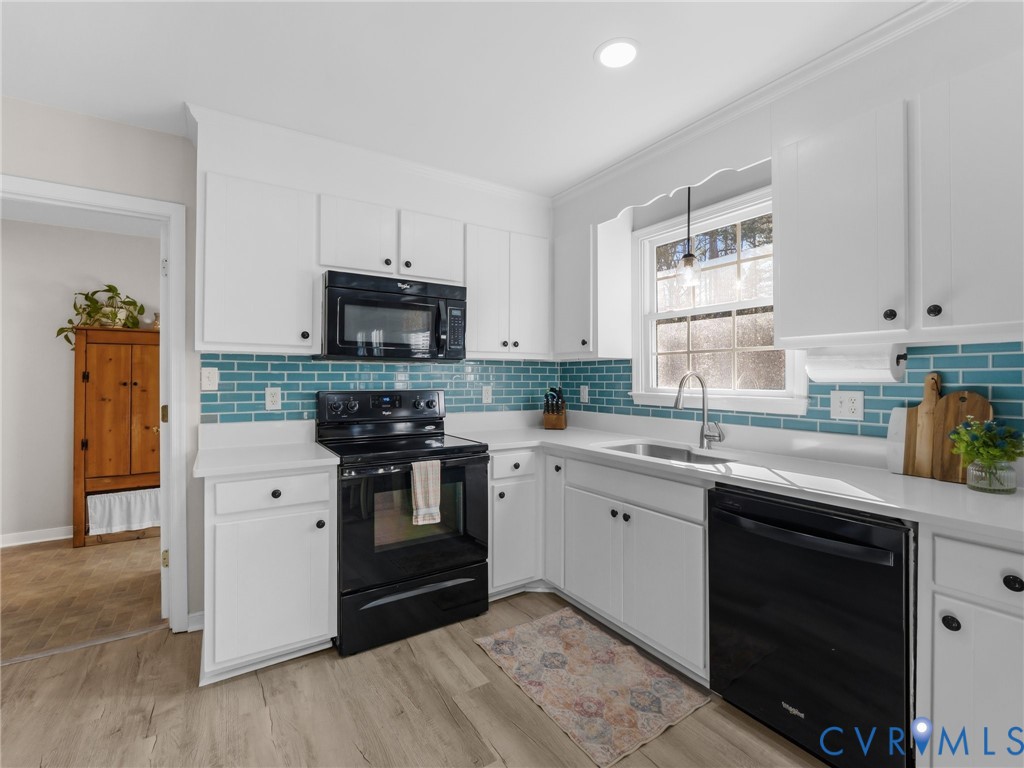 206 Rustic Drive Carson, VA 23830 - Photo 19 of 51 a kitchen with a sink stove and microwave