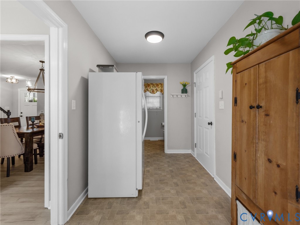 206 Rustic Drive Carson, VA 23830 - Photo 24 of 51 a view of a hallway with wooden floor and closet area