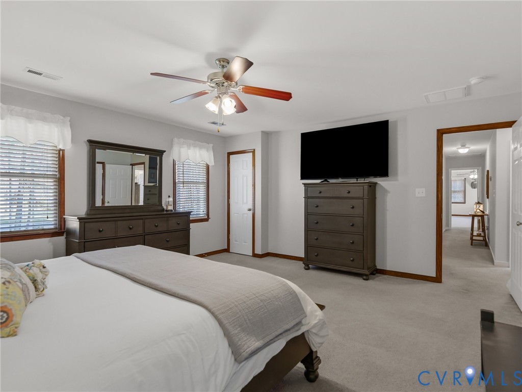 206 Rustic Drive Carson, VA 23830 - Photo 27 of 51 a bedroom with a bed and a flat screen tv