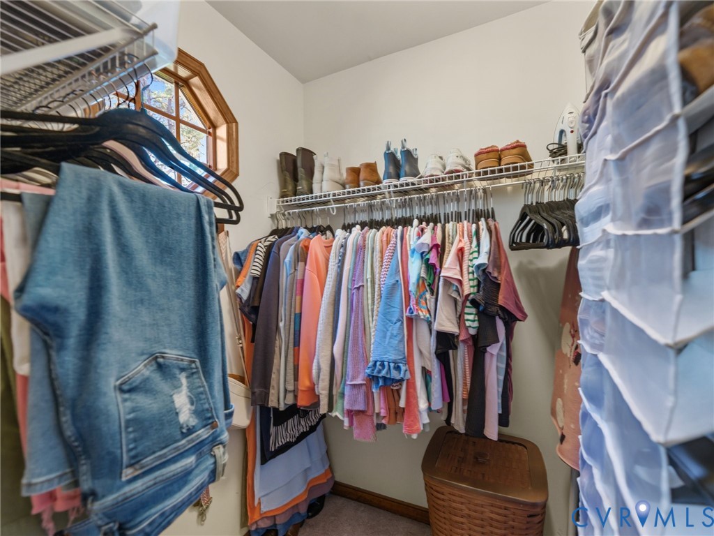 206 Rustic Drive Carson, VA 23830 - Photo 30 of 51 a view of walk in closet with clothes and shoes