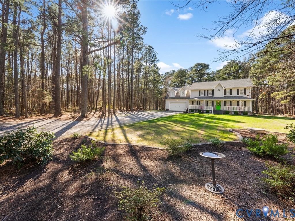 206 Rustic Drive Carson, VA 23830 - Photo 3 of 51 a view of a swimming pool with a patio and a yard