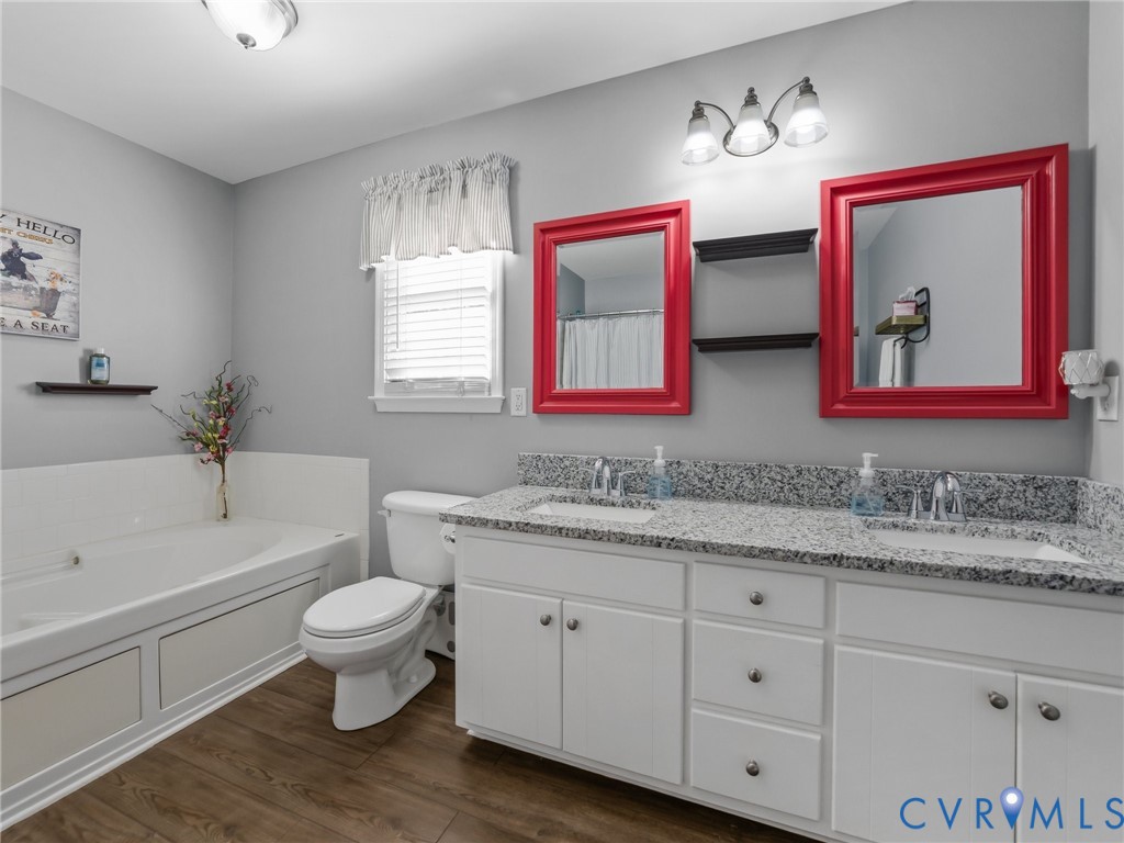 206 Rustic Drive Carson, VA 23830 - Photo 31 of 51 a bathroom with a toilet a sink and bathtub