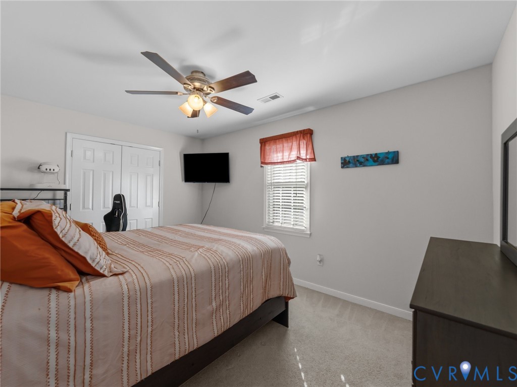 206 Rustic Drive Carson, VA 23830 - Photo 34 of 51 a bedroom with a bed and a window