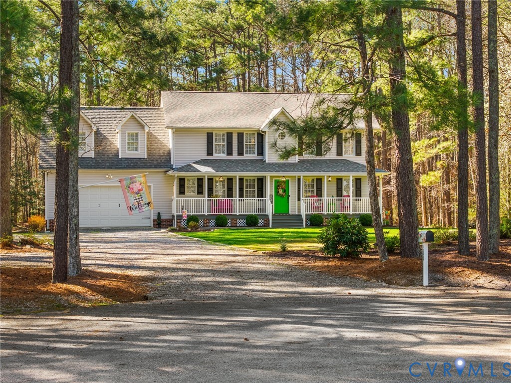 206 Rustic Drive Carson, VA 23830 - Photo 4 of 51 a front view of a residential apartment building with a yard
