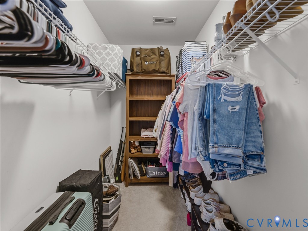 206 Rustic Drive Carson, VA 23830 - Photo 43 of 51 a view of walk in closet with clothes