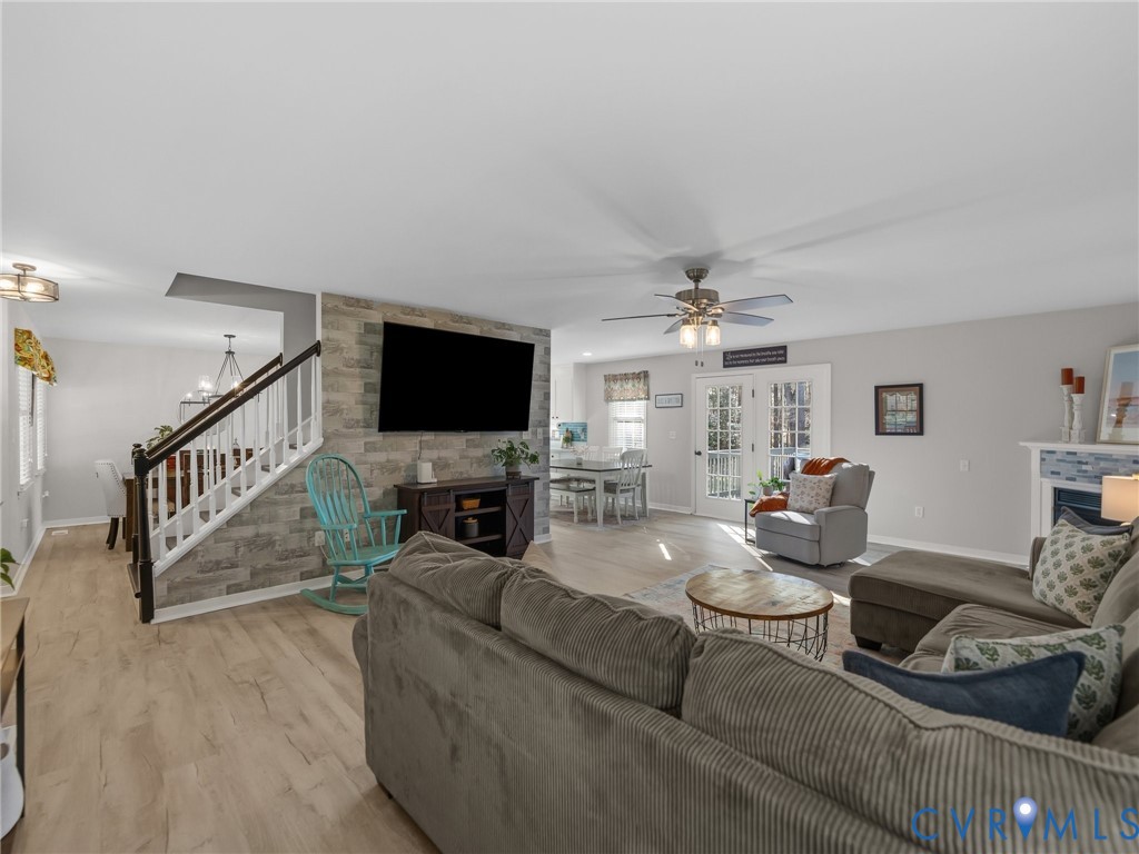 206 Rustic Drive Carson, VA 23830 - Photo 8 of 51 a living room with furniture and a flat screen tv