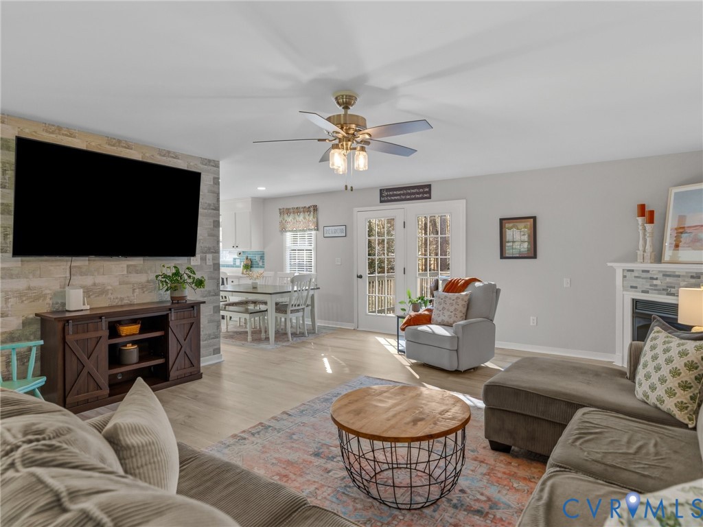 206 Rustic Drive Carson, VA 23830 - Photo 10 of 51 a living room with furniture and a flat screen tv