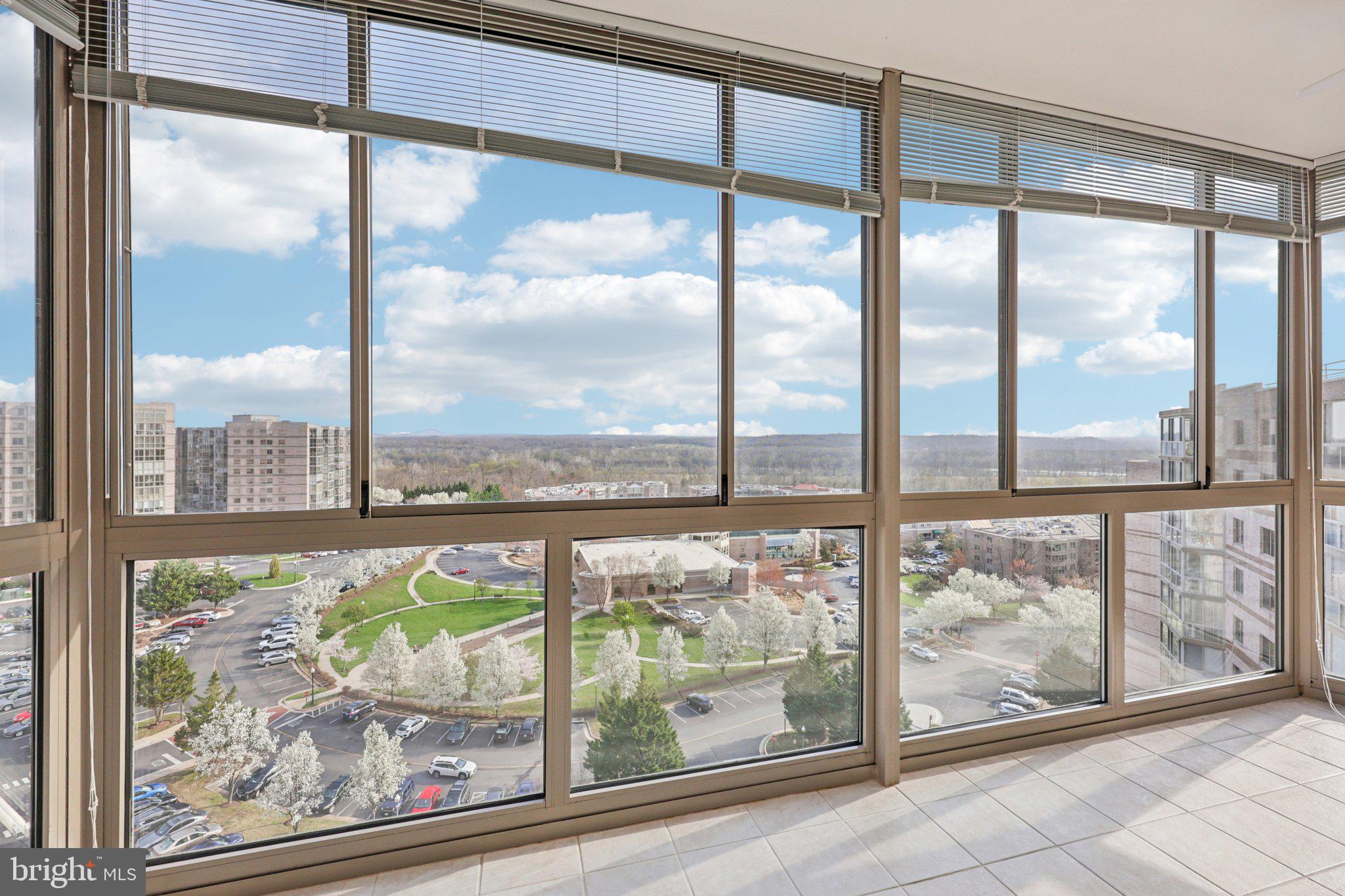 19375 Cypress Ridge Terrace, Unit 1111 Leesburg, VA 20176 - Photo 24 of 35 a view of a glass door with a glass top