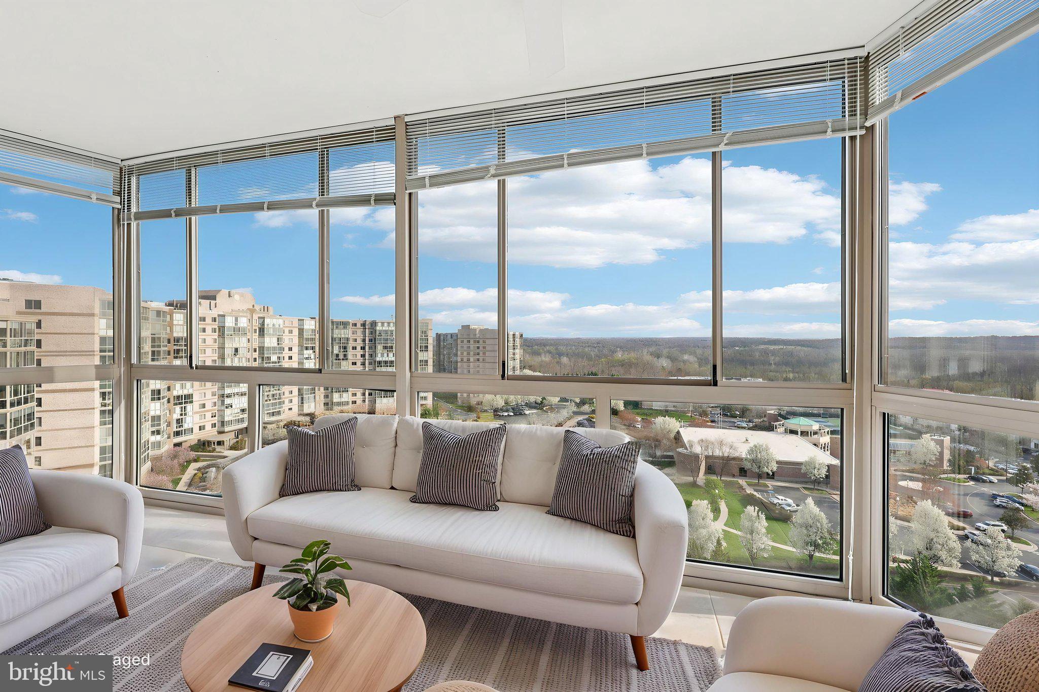 19375 Cypress Ridge Terrace, Unit 1111 Leesburg, VA 20176 - Photo 29 of 35 a roof deck with couch and a large window