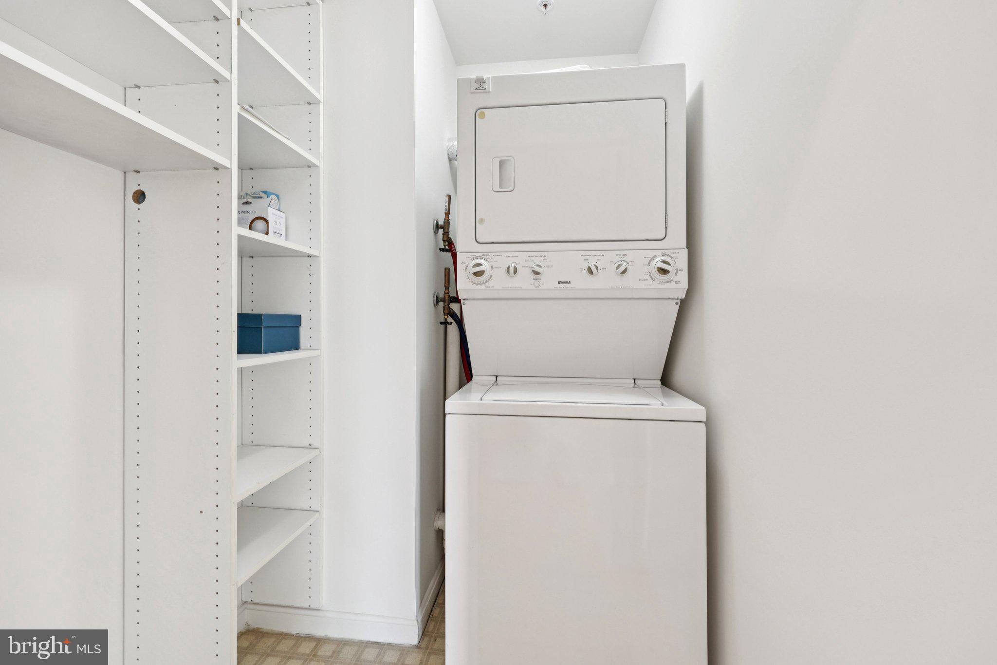 19375 Cypress Ridge Terrace, Unit 1111 Leesburg, VA 20176 - Photo 31 of 35 a view of bathroom with a washer and dryer