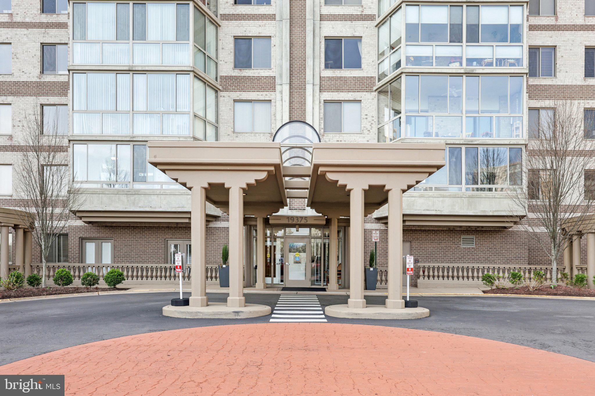 19375 Cypress Ridge Terrace, Unit 1111 Leesburg, VA 20176 - Photo 4 of 35 front view of a brick building