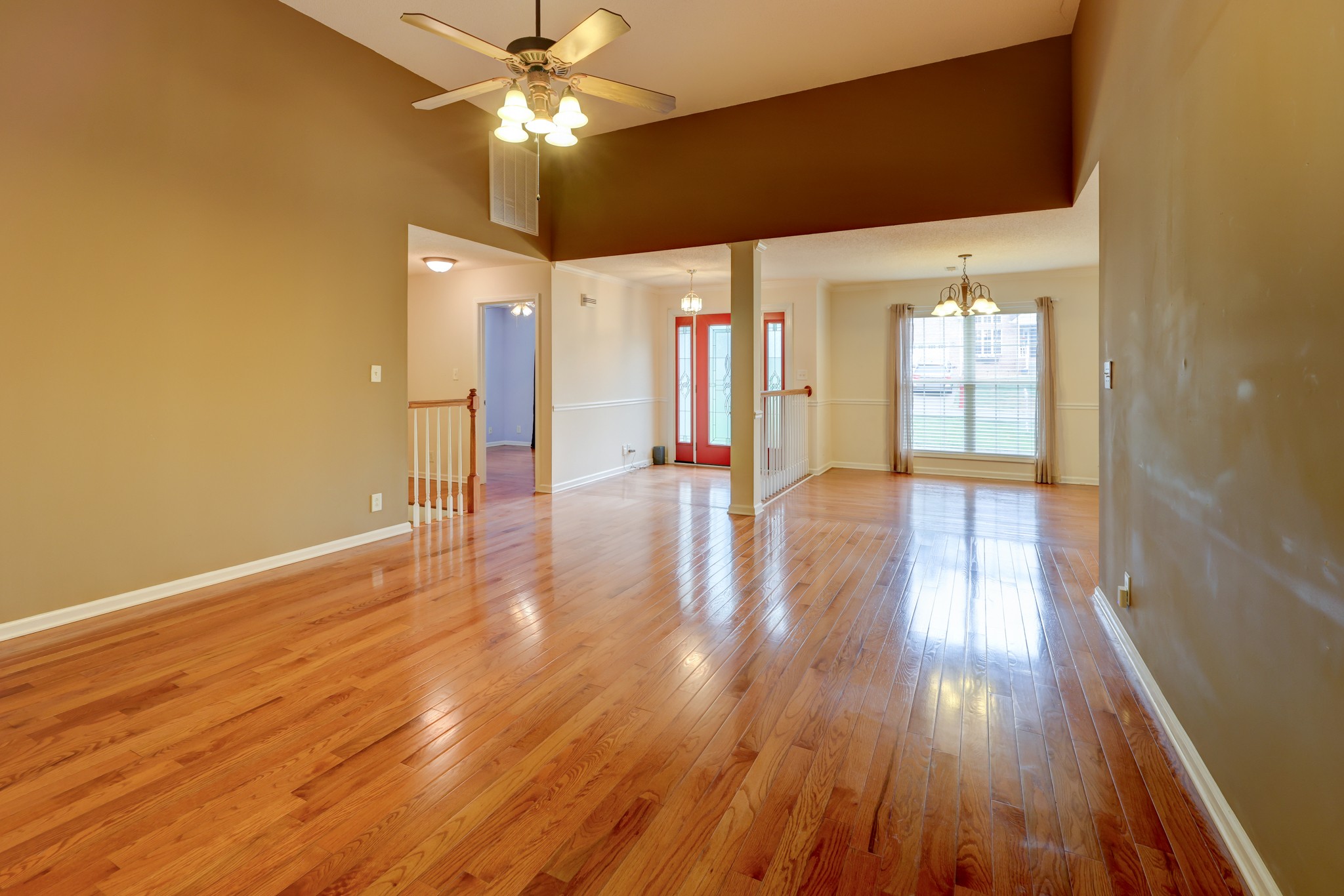4445 Taylor Hall Lane Adams, TN 37010 - Photo 15 of 65 a view of an empty room with window and wooden floor