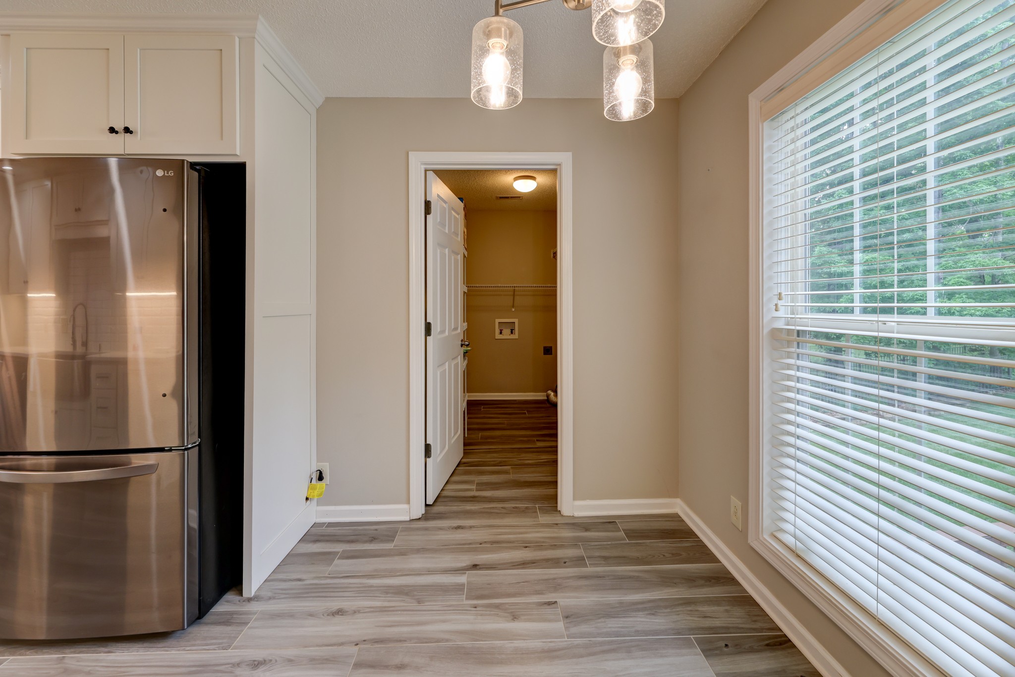 4445 Taylor Hall Lane Adams, TN 37010 - Photo 20 of 65 a view of a hallway with wooden floor and staircase