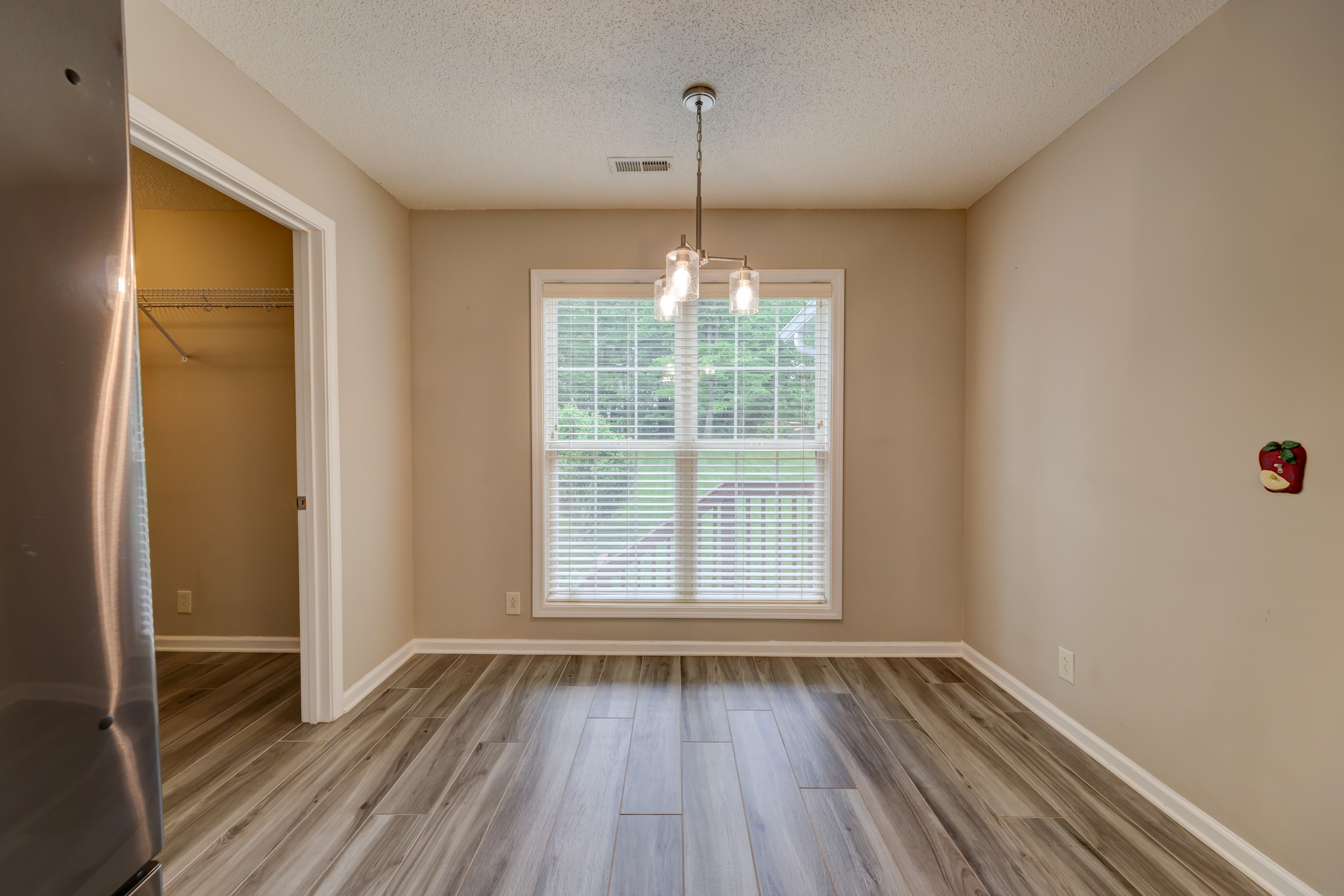 4445 Taylor Hall Lane Adams, TN 37010 - Photo 22 of 65 a view of a room with wooden floor and windows