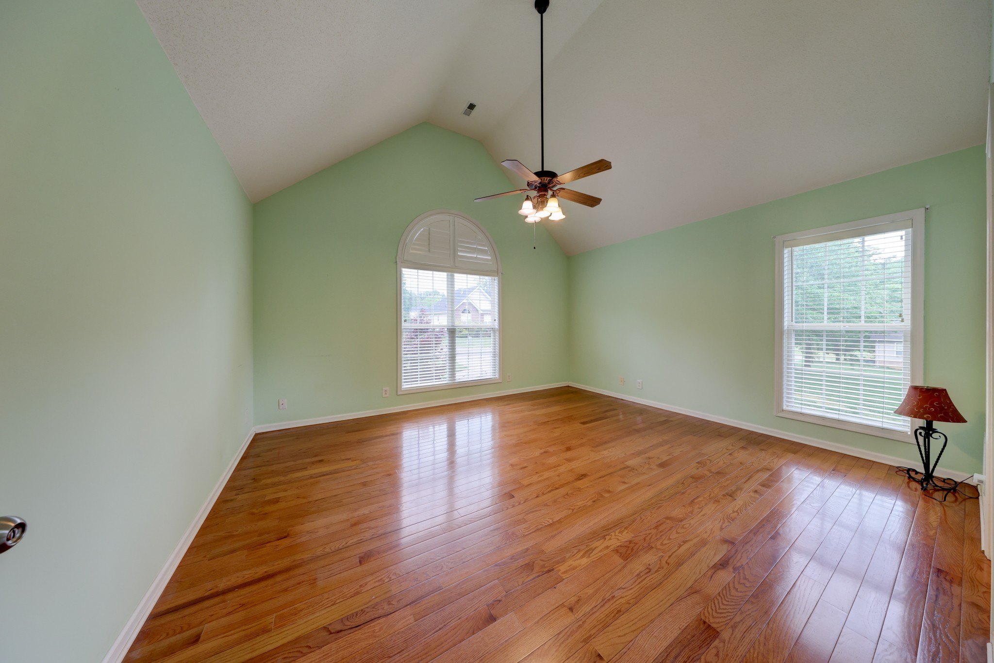 4445 Taylor Hall Lane Adams, TN 37010 - Photo 25 of 65 a view of empty room with wooden floor and fan