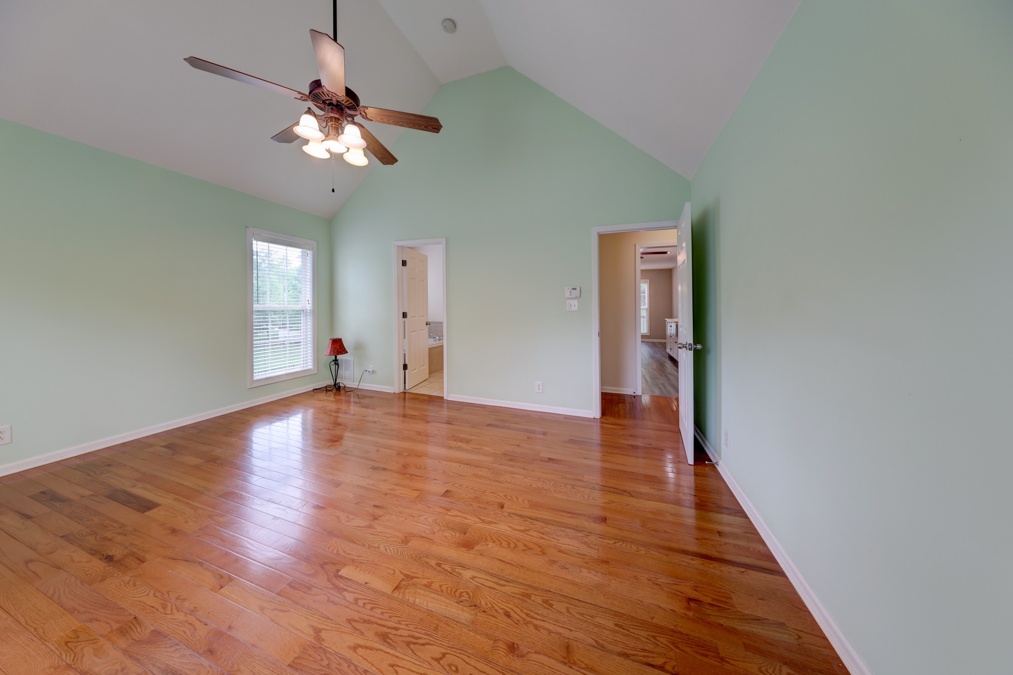 4445 Taylor Hall Lane Adams, TN 37010 - Photo 26 of 65 a view of a livingroom with wooden floor and chandelier
