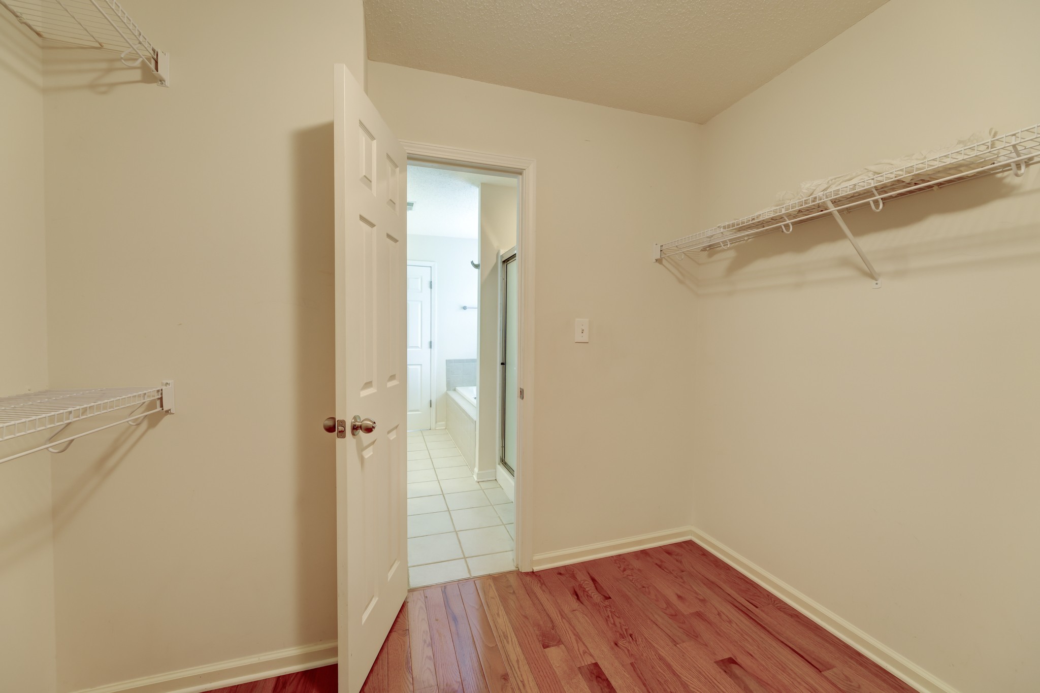 4445 Taylor Hall Lane Adams, TN 37010 - Photo 36 of 65 a view of bathroom with a shower and a wooden floor