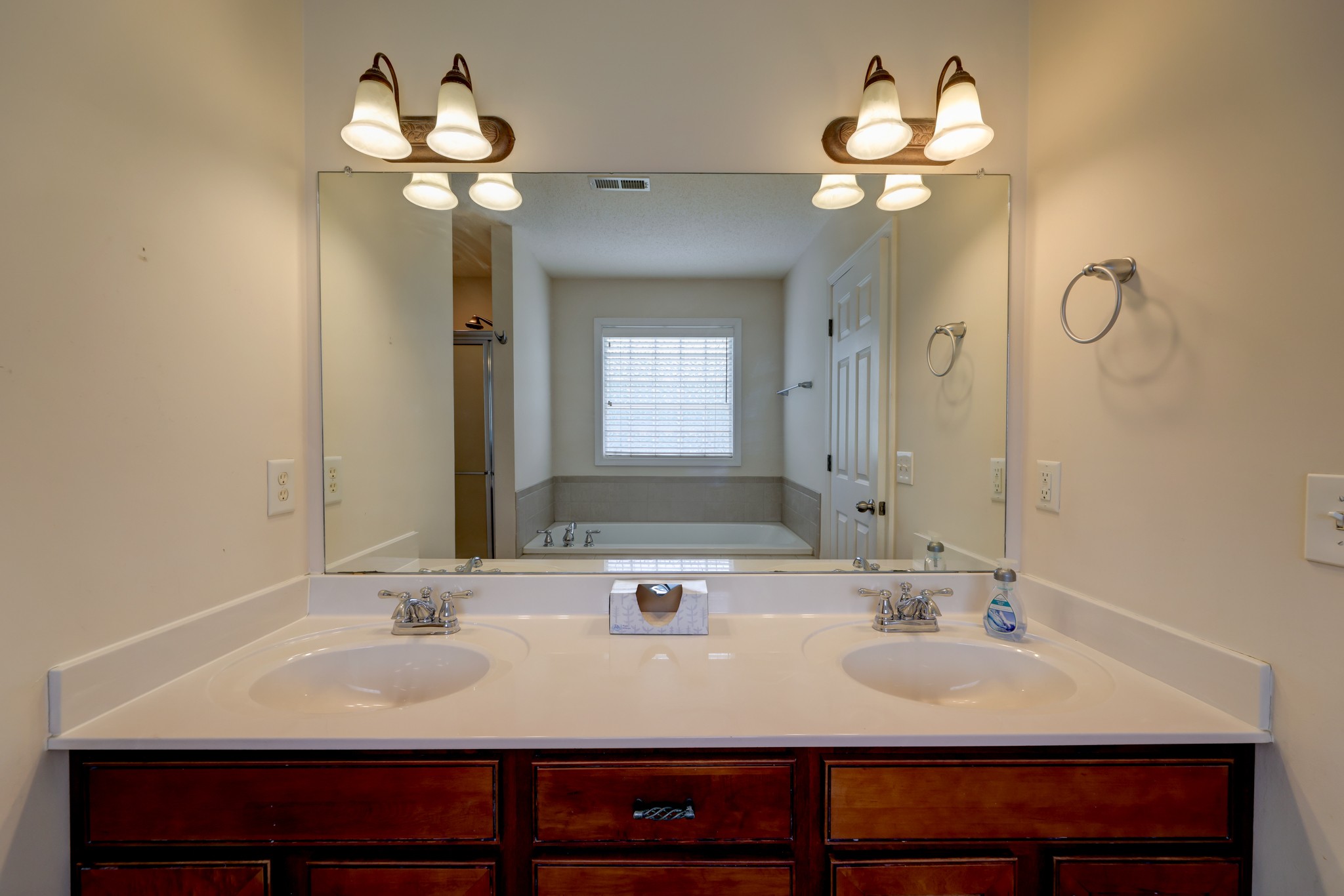 4445 Taylor Hall Lane Adams, TN 37010 - Photo 39 of 65 a bathroom with a sink and a mirror