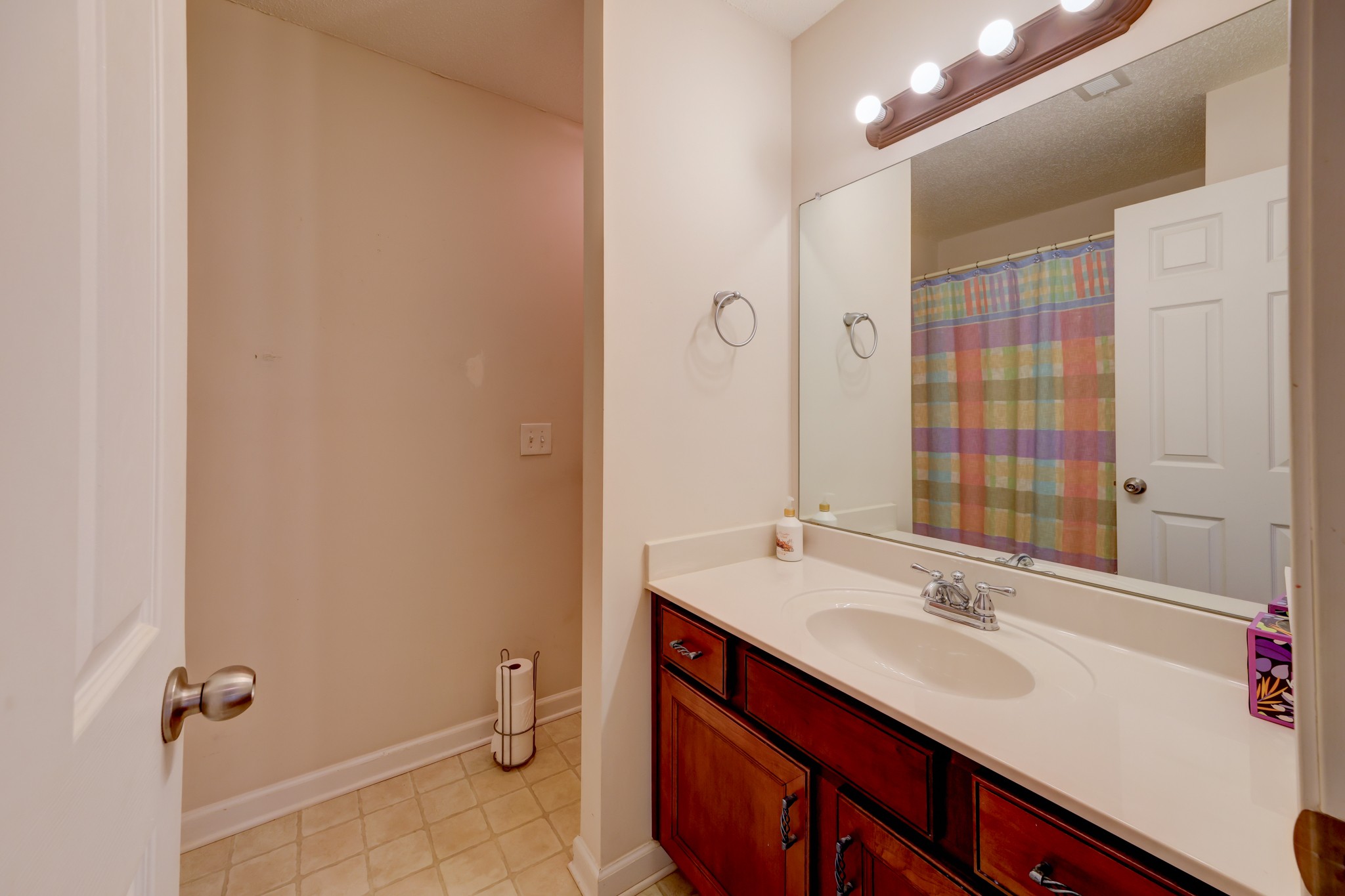 4445 Taylor Hall Lane Adams, TN 37010 - Photo 45 of 65 a bathroom with a sink and a mirror