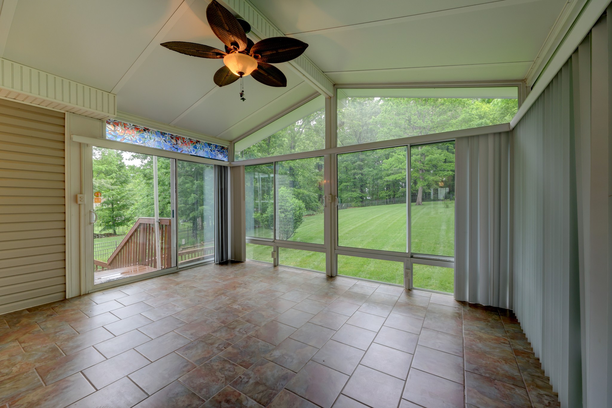 4445 Taylor Hall Lane Adams, TN 37010 - Photo 51 of 65 a view of an empty room with windows and ceiling fan