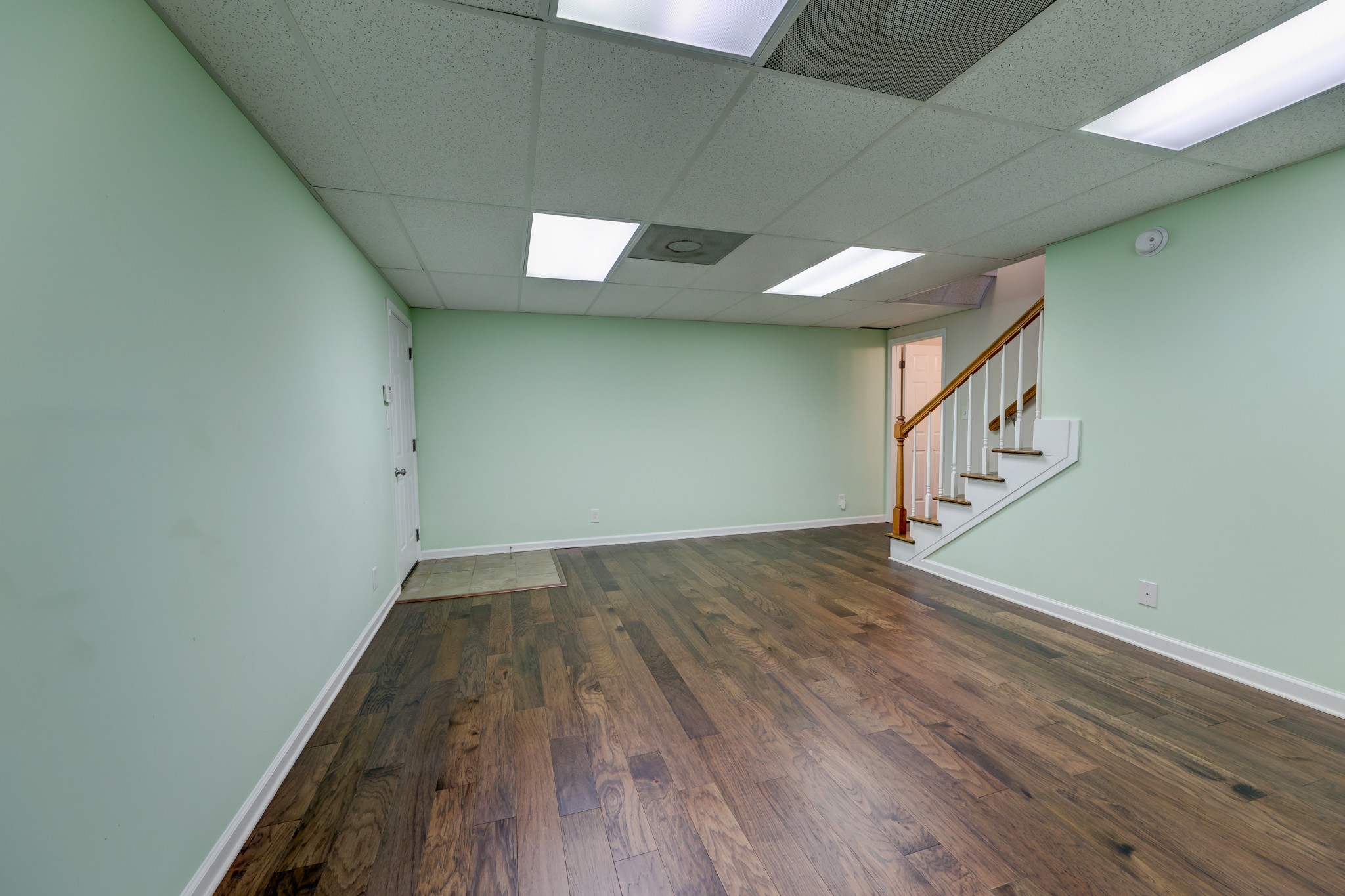 4445 Taylor Hall Lane Adams, TN 37010 - Photo 54 of 65 a view of an empty room with wooden floor