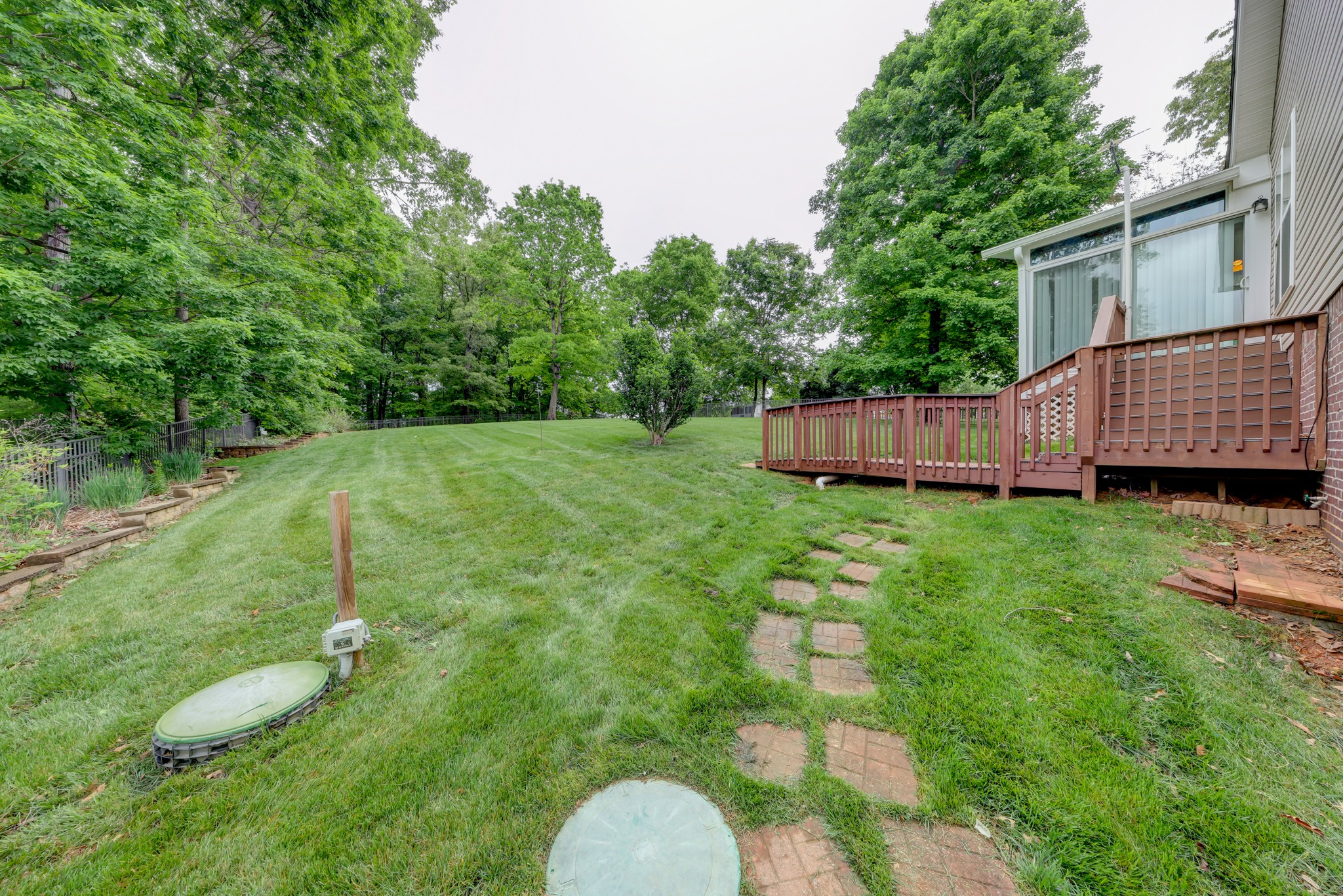 4445 Taylor Hall Lane Adams, TN 37010 - Photo 62 of 65 a backyard of a house with table and chairs
