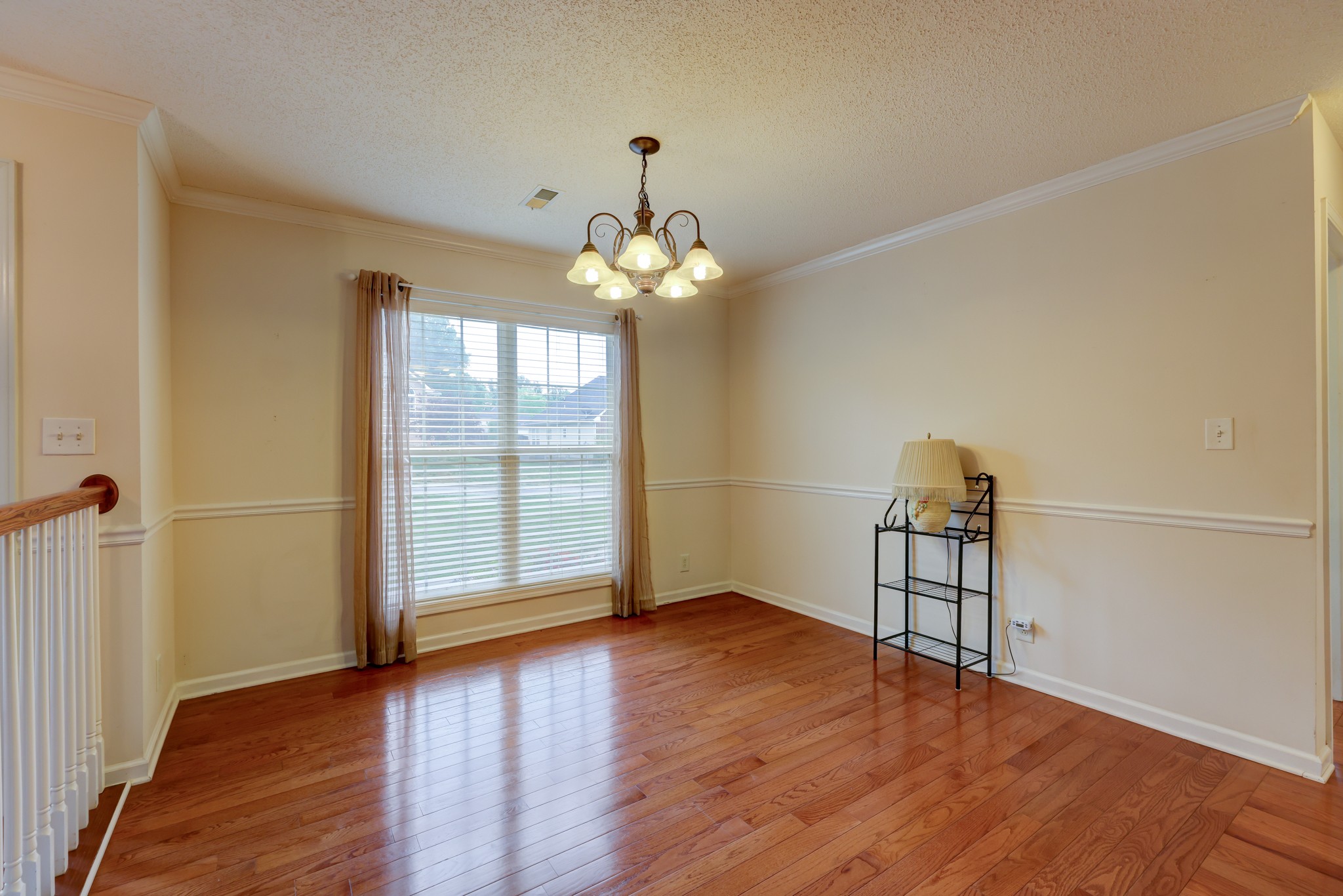 4445 Taylor Hall Lane Adams, TN 37010 - Photo 10 of 65 an empty room with wooden floor and windows