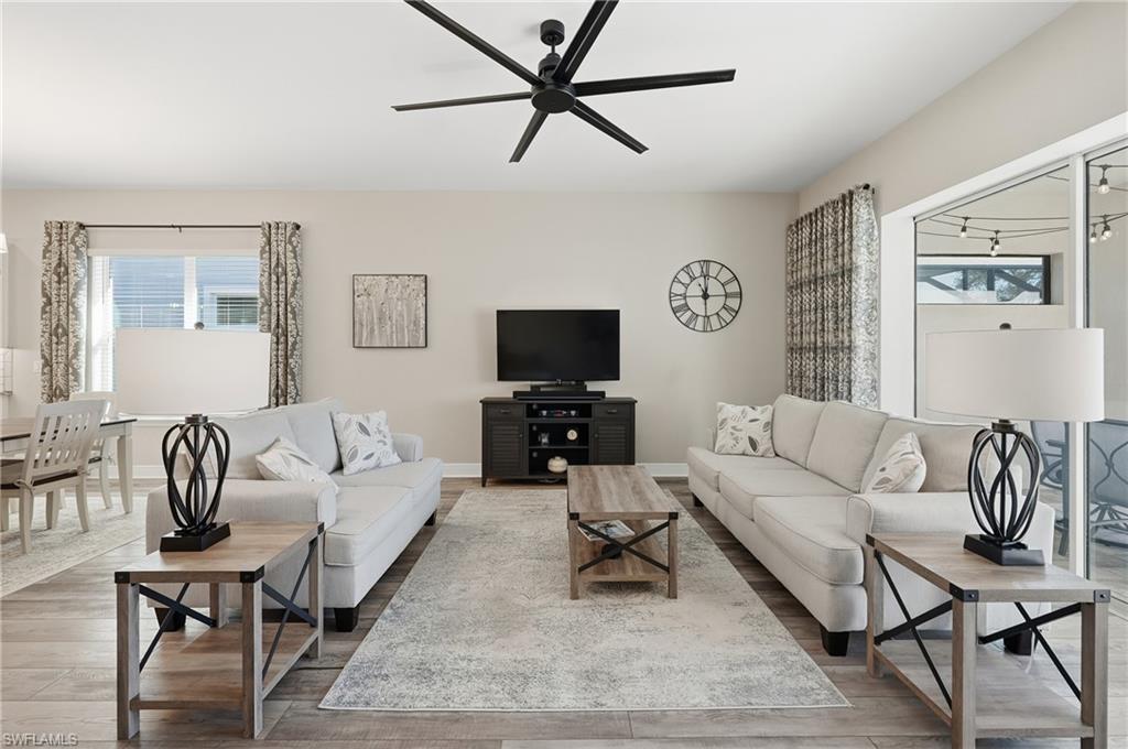 3344 Pilot Circle Naples, FL 34120 - Photo 10 of 50 a living room with furniture and a flat screen tv