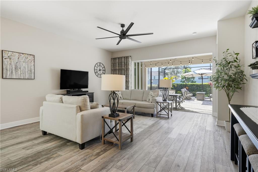 3344 Pilot Circle Naples, FL 34120 - Photo 11 of 50 a living room with furniture and a flat screen tv