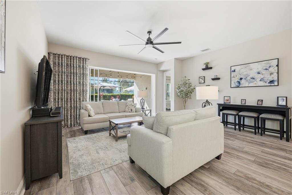 3344 Pilot Circle Naples, FL 34120 - Photo 13 of 50 a living room with furniture and a flat screen tv