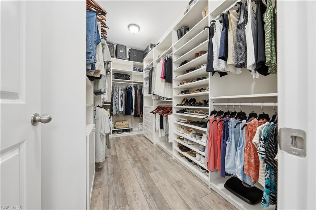 3344 Pilot Circle Naples, FL 34120 - Photo 19 of 50 a view of walk in closet with clothes and shoes