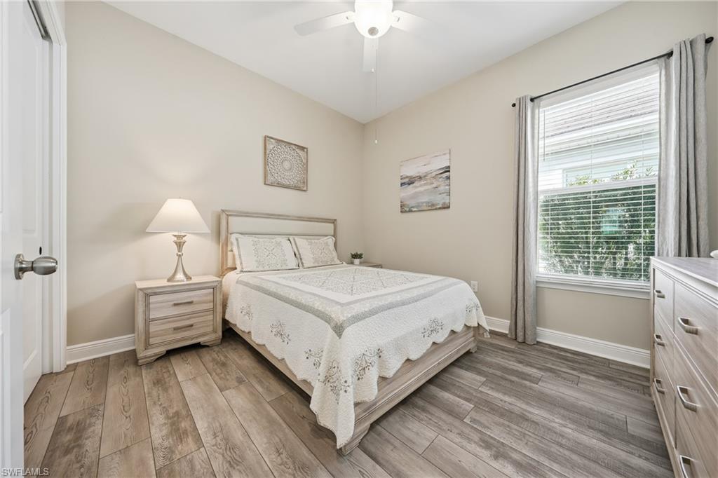 3344 Pilot Circle Naples, FL 34120 - Photo 21 of 50 a bedroom with a large bed and a window