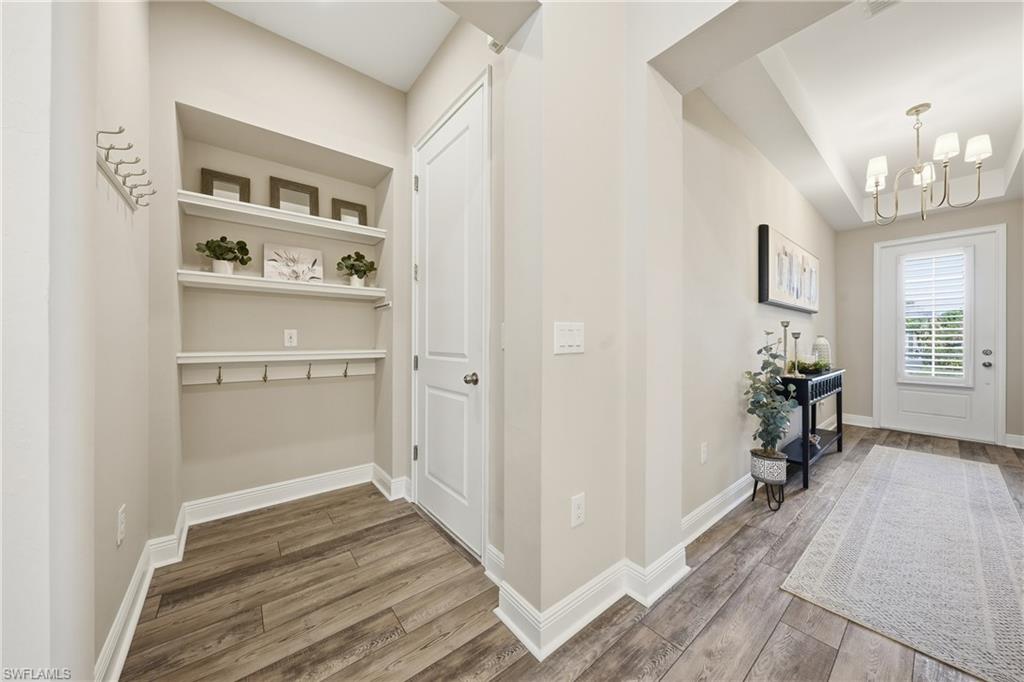 3344 Pilot Circle Naples, FL 34120 - Photo 25 of 50 a view of a hallway with wooden floor and closet