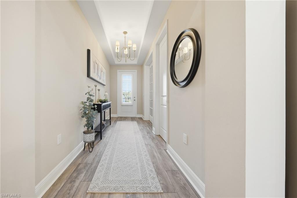 3344 Pilot Circle Naples, FL 34120 - Photo 26 of 50 a front view of a house with garden