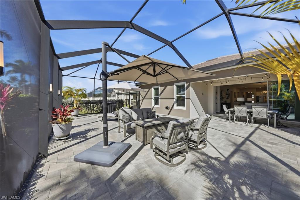 3344 Pilot Circle Naples, FL 34120 - Photo 33 of 50 a view of a patio with table and chairs