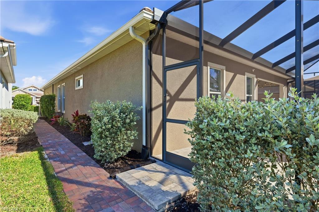 3344 Pilot Circle Naples, FL 34120 - Photo 35 of 50 a front view of a house with garden