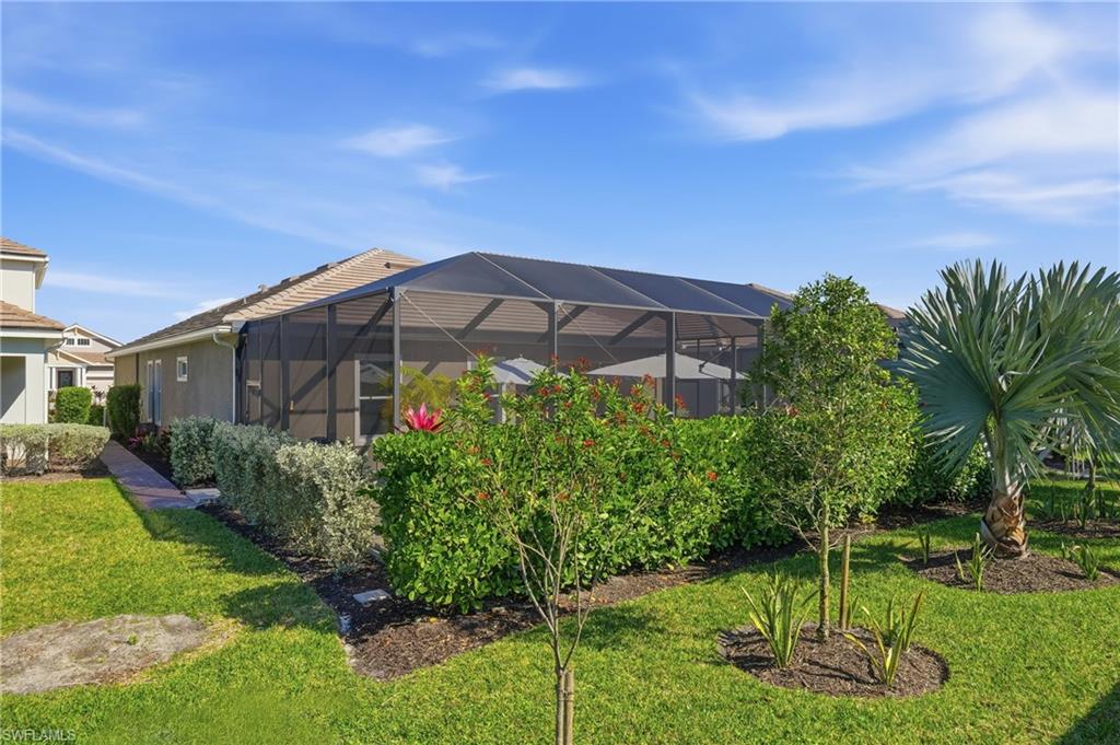 3344 Pilot Circle Naples, FL 34120 - Photo 38 of 50 a view of a chair and table in front of house