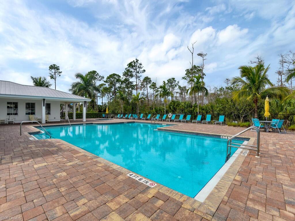 3344 Pilot Circle Naples, FL 34120 - Photo 48 of 50 a view of swimming pool with a yard