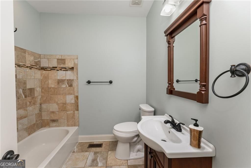 1158 Bailey Road Aragon, GA 30104 - Photo 28 of 73 a bathroom with a sink toilet and shower