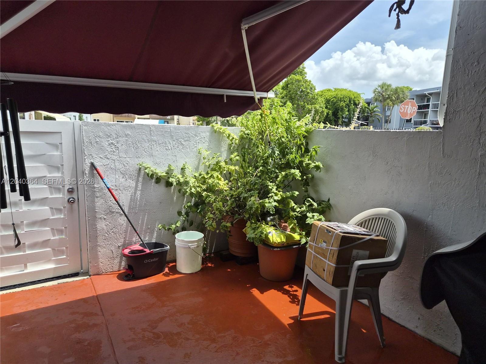 6201 Southwest 138th Court Miami, FL 33183 - Photo 3 of 7 a view of a porch with furniture and a potted plants